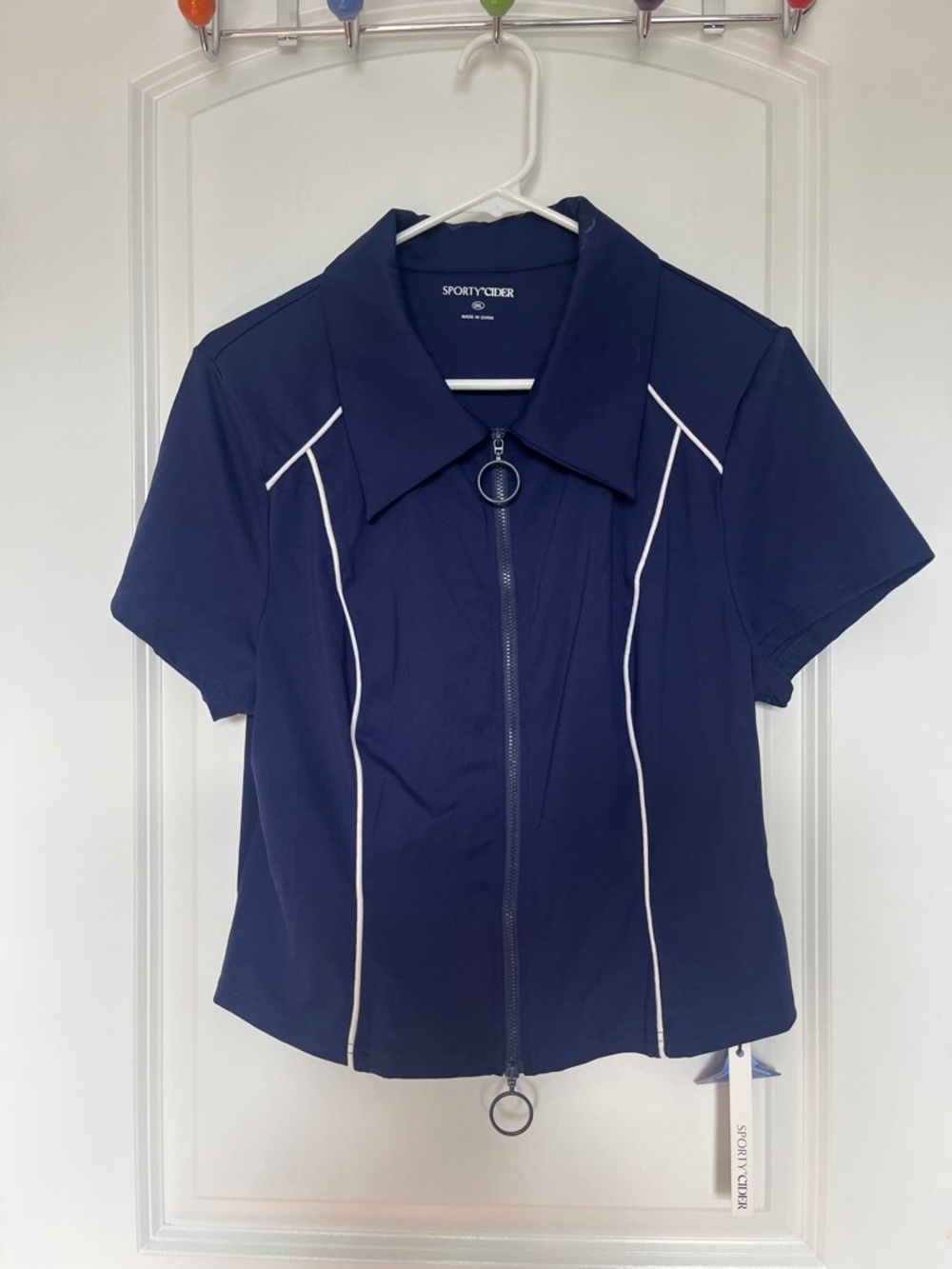 CIDERAIRY  Short Sleeve Zip Navy Stretchy Top with White Piping